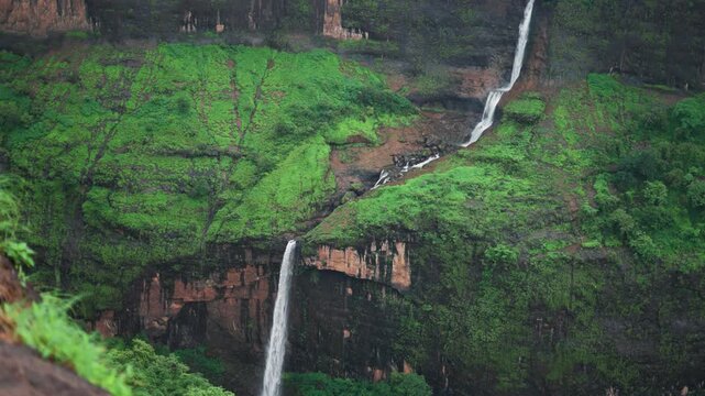 4K Slow motion shot of waterfall falling from the Sahydari hills during the monsoon season at Maharashtra in India. Ring waterfall near Pune during the monsoon season after rain. Nature background.