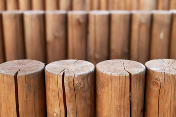 close-up of wooden pillars standing vertically next to each other