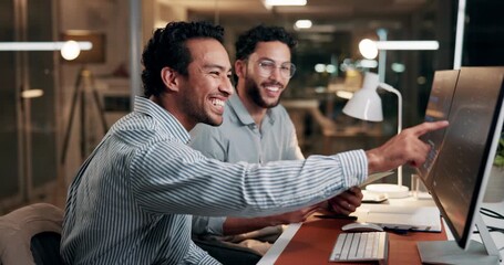 Computer, team and business men planning for trading, finance or pointing at night. Desktop, discussion and happy traders in office for investment meeting, stock market growth and profit on overtime - Powered by Adobe