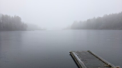 Pirs end fog on the river in the forest 