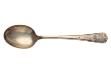 Antique tarnished silver spoon with an ornate crested handle isolated on a transparent background