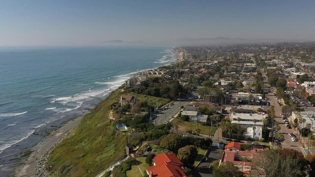 Aerial view of Yogananda Ashram near the coastline, with the blue ocean contrasting against the green cliffs, Encinitas, California, United States.