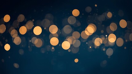 Soft focus golden bokeh lights on a dark blue background abstract festive celebration