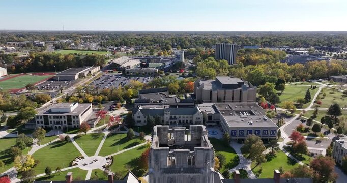 Aerial view of the University of Toledo campus, showcasing its buildings, clock tower, sports fields, and autumn foliage, Toledo, Ohio, United States.