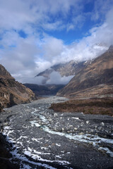 Mountain river flowing through rocky valley