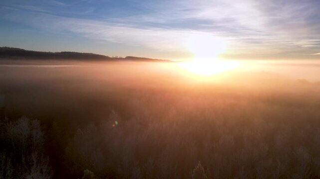 erial Drone Flight Over Dense Fog with Sunrise in Rural Alberta &ndash; Misty Forest Canopy Hidden Below
