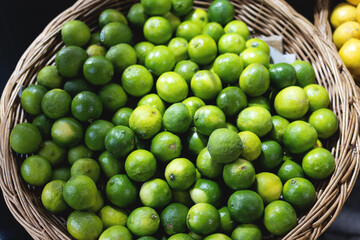 Fresh Green Limes in Wicker Basket