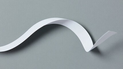 drape. A white ribbon curving downward against a minimalist gray background. wellbeing guides, coaching materials, designed for mental health education and mindfulness programs, clarifies learning.