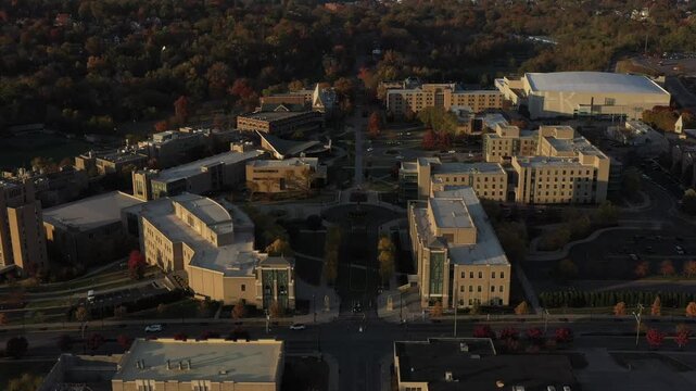 Aerial view of buildings with unique architecture surrounded by trees, roads and cars, creating a contrast of colors and shapes, Cincinnati, Ohio, United States.