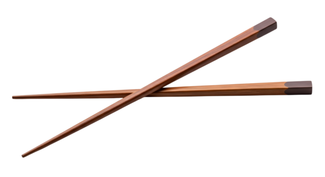 Two wooden chopsticks with dark tips crossed diagonally on a dark surface isolated on a transparent background - Powered by Adobe