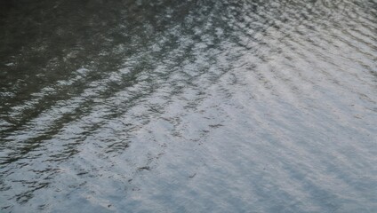 Abstract Water Surface with Ripples and Reflections.