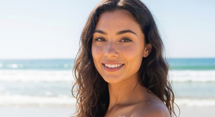 Close-up portrait of a happy young woman smiling at the beach. Natural beauty with healthy skin on a sunny summer day with copy space