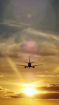 Passenger Airplane Taking Off Into A Beautiful Sunset.