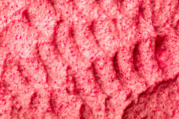 Fruit pink ice cream. Yogurt smoothie with fresh fruits and berries. Ice cream texture. Delicious sweet dessert close-up as background.
