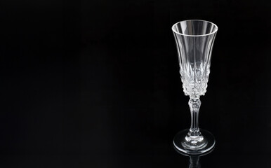 Elegant Crystal Champagne Flute on Black Background with Reflections