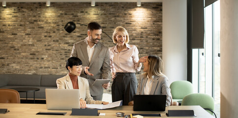 Business team collaboration in modern office setting during daytime meeting