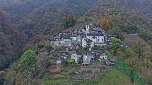 Old stone buildings of Corippo, Switzerland, in mountain setting.