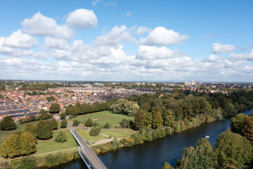 Obraz premium Aerial drone photo of the famous Millennium Bridge which is a footbridge that runs over the River Ouse in the heart of the city of York in Yorkshire in the UK in the summer time