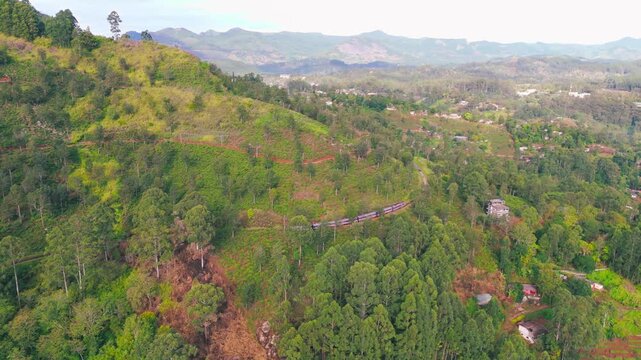 Peaceful Morning Journey as Train Travels Toward a Quiet Town in Mountain Landscape