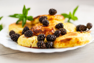 Cottage cheese pancakes with pine cone jam and mint