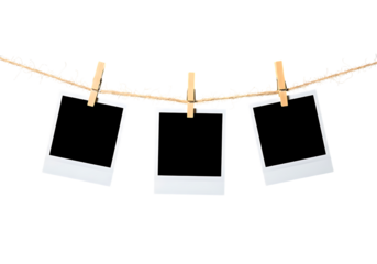 Three blank instant photo frames hanging on a rustic vine string isolated on transparent background