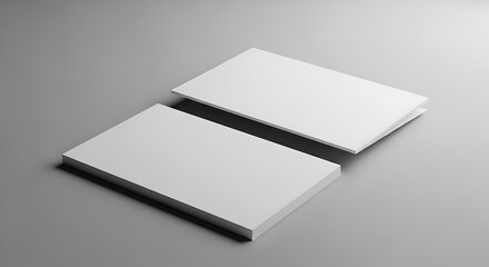 Blank white business cards mockup on a grey background, perfect for showcasing corporate identity, branding, and professional design