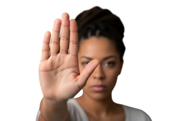 a close up shot of a young woman with a focused expression making a stop hand gesture with her palm facing forward on