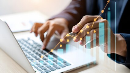 Business professional analyzing financial data and stock market trends on a laptop