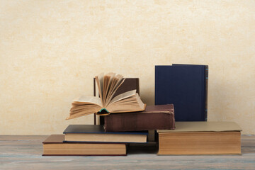 Stack of colorful books. Education background. Back to school. Book, hardback colorful books on wooden table. Education business concept. Copy space for text.