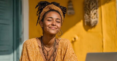 Woman Wearing a Colorful Outfit Smiles Warmly in Front of a Vibrant Yellow Wall