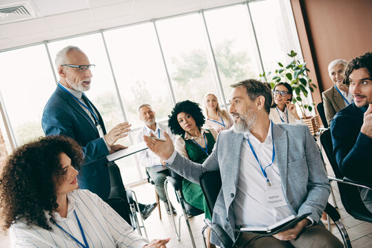 Professional team discusses business strategies in a conference setting, showcasing collaboration and teamwork.