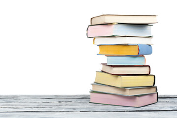 Open stacking book, hardback colorful books on wooden table and white background. Back to school. Copy space for text. Education business concept.