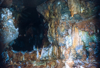 Colourful stalactite and stalagmite formations inside the Aven d'Orgnac cave in Ardèche, France