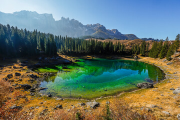 Scenic autumn landscape of Carezza lake or Lago di Carezza, Karersee in Dolomites Alps, South Tyrol, Italy, Europe	