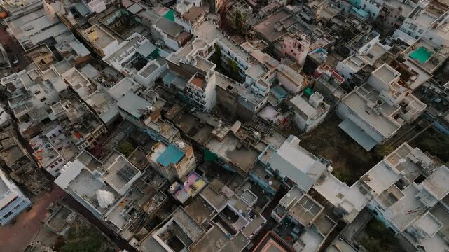 Aerial view of Pushkar Lake surrounded by buildings, showcasing the architectural layout and serene waters, Pushkar, Rajasthan, india.