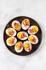 Spicy, stuffed ramen eggs, with bacon and green onions, homemade, no people,