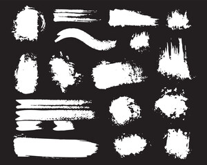 Various grunge white paint strokes and textured brush elements