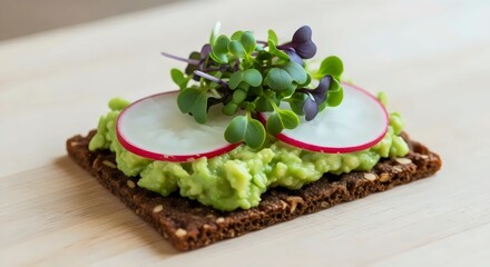 Rustic rye crispbread topped with avocado spread for wholesome plant-based snack and cozy lifestyle inspiration