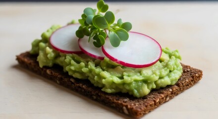 Organic rye tartine with avocado topping for healthy plant-based appetizer and sustainable lifestyle concept