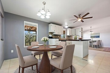 This is a dining room featuring a table and several chairs found within a house