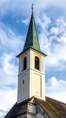Fototapeta premium Close-up of church steeple against a blue, cloudy sky