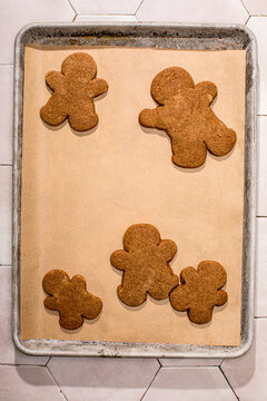 Gingerbread people cookies on parchment paper
