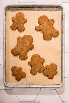 Gingerbread people cookies on parchment paper
