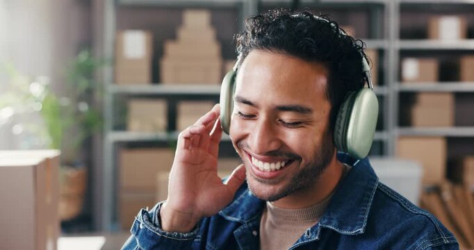 Happy man, logistics or listening with headphones to music for vibe, playlist or podcast in storage. Businessman, smile and tune with smile for audio streaming, sound app or small business startup