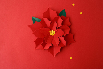 Festive paper poinsettia craft scene for Christmas DIY, ideal for education, children activities,...