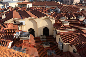 Istanbul Rooftops, Terracotta Tiles, Cityscape: Aerial view showcasing historical architecture's red tile roofs.