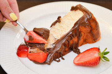 Fototapeta premium San Sebastian cheesecake with chocolate sauce. Delicious homemade dessert.