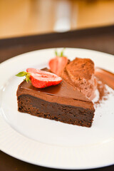 Piece of chocolate brownie cake. Delicious homemade dessert.