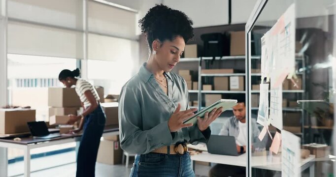 Logistics, woman or tablet at glass board for stock control, KPI performance or demand forecasting. Shipping, staff or tech with graph paperwork in small business for order processing or supply chain