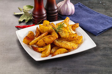 Baked crispy hot potato with rosemary